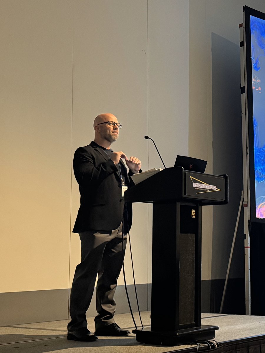 At the podium during the prompt engineering session